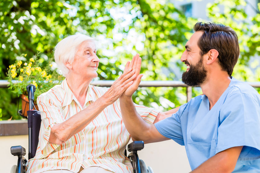 Male volunteer visiting older woman